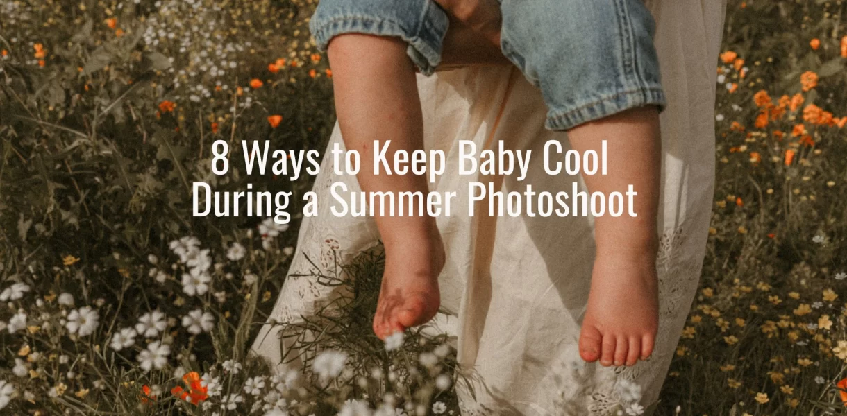 Close-up of a barefoot baby being held in a field of wildflowers with text overlay about keeping baby cool during a summer photoshoot