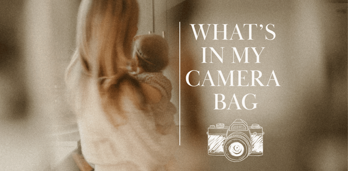 Soft-focus photo of a woman holding a baby with text overlay “What’s in My Camera Bag” and a camera illustration