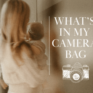 Soft-focus photo of a woman holding a baby with text overlay “What’s in My Camera Bag” and a camera illustration
