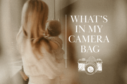 Soft-focus photo of a woman holding a baby with text overlay “What’s in My Camera Bag” and a camera illustration